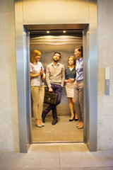 Business people standing in elevator © MDBPIXS
