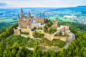 Hohenzollern Castle on mountain, Germany. This castle is a famous landmark in Stuttgart vicinity. Aerial panoramic view of Burg Hohenzollern in summer. Landscape of Swabian Alps with Gothic castle.