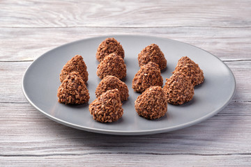 Chocolate truffles in a rustic plate