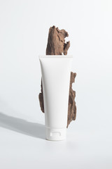 cosmetic mockup cream bottle pakage with beauty spa treatment concept with herb tree wood bark