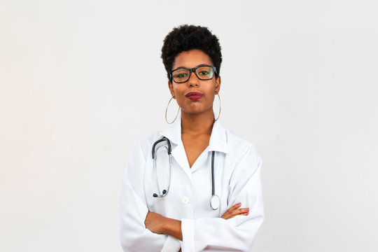 Portrait of Brazilian black woman doctor with stethoscope, white background
