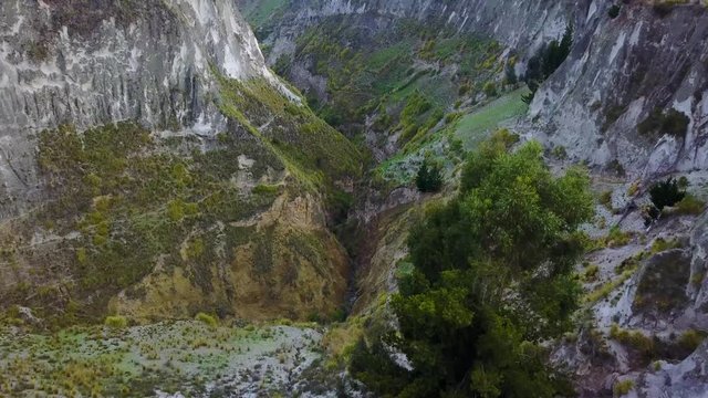 Aerial shot deep canyon near Quilotoa, Ecuador caldera in the Andes Mountains.