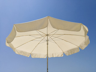 Wide angle view of beach umbrella sunny day