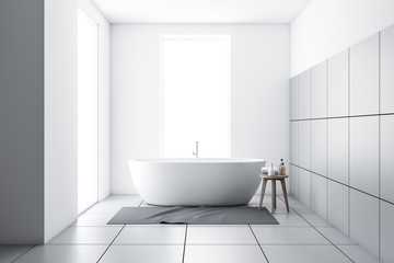 Fototapeta na wymiar White tiled bathroom with tub and carpet