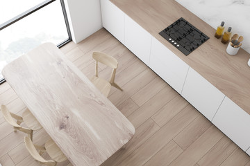 Fototapeta na wymiar Top view of kitchen with wooden table