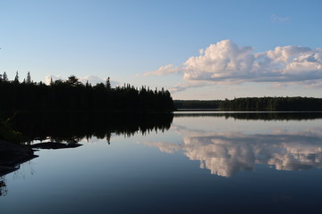 Rain Lake, Algonquin Provincial Park, Canada (still lake reflection at sunset with trees and clouds)