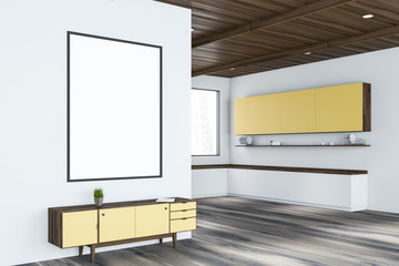 Poster and cabinet in white living room, kitchen