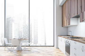 White and wood kitchen interior with table