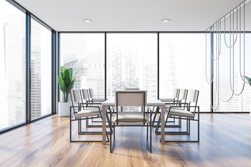 Panoramic meeting room with white chairs