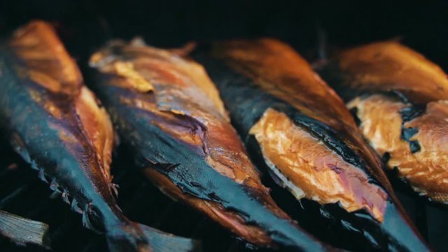 Smocked scomber cooking in the smokehouse. BBQ.
