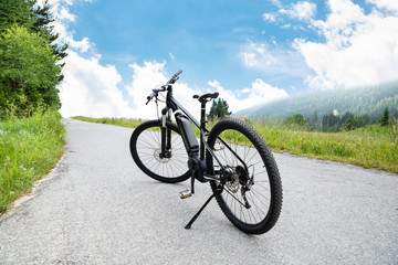 Fototapeta na wymiar Electric Mountain Bike In Mountains