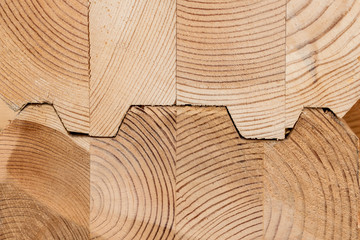 Wood Glued timber close up. Wooden grain timber end background. Glued pine timber beams. Wood for...