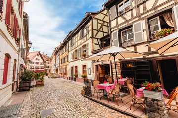 Quiet Street with famous half timbered houses and restaurant in Strassburg, Alsace
