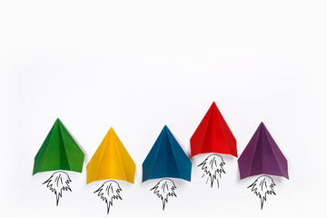 Color paper airplanes on white background. Different vision creative and Innovative solution for Business concepts.