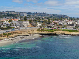 Aerial view of La Jolla Cove, small picturesque cove and beach surrounded by cliffs, San Diego, California. Protected marine reserve, popular with snorkelers and swimmers. Travel destination.