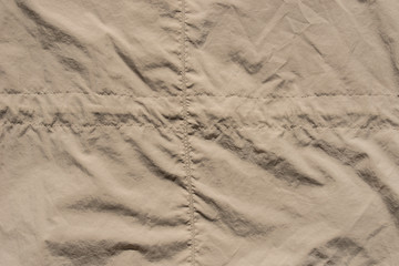 creased beige textile background texture