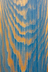 The structure of natural wood painted blue. The texture of the pine. Creative vintage background.