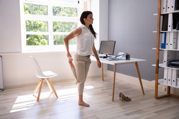 Young Businesswoman Doing Yoga