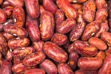 Red kidney bean texture background. Also called Rajma or Mexican Bean. A large, kidney-shaped bean with a subtle sweet flavor and soft texture that keep their shape during cooking.