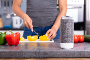 Woman Listening Music On Smart Speaker