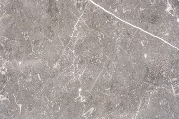 The structure of natural concrete with white veins. The texture of gray concrete. Creative vintage background.