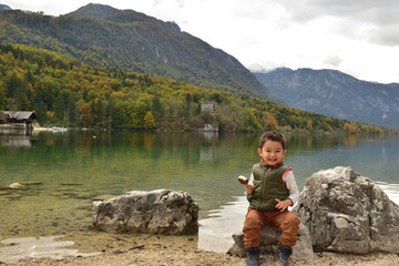 Cute boy traveling in Slovenia in the fall