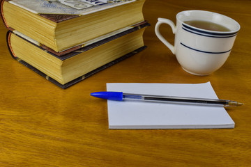 old books and a cup of tea