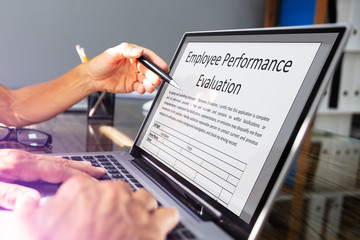 Businessman Filling Employee Performance Evaluation Form