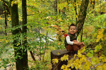 Cute boy traveling in Slovenia in the fall