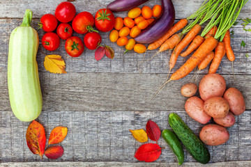 Assortment different fresh organic vegetables on country style wooden background. Healthy food vegan vegetarian dieting concept. Local garden produce clean food. Frame top view flat lay copy space