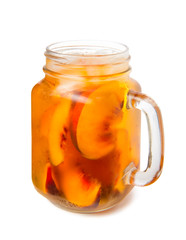 peach iced tea in a glass jar summer soft drink isolated on white background