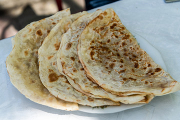 Azerbaijani qutabs with greens and meat filling in Sheki, Azerbaijan.