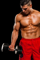 Fototapeta na wymiar Shirtless Muscular Men Exercise With Weights