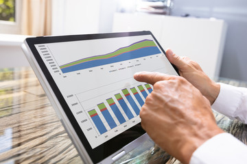 Businessman Looking At Graph