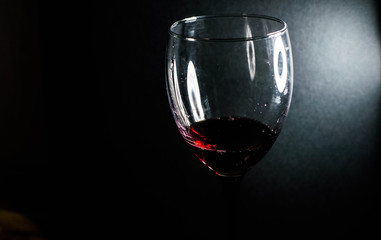 Red wine is poured into a glass