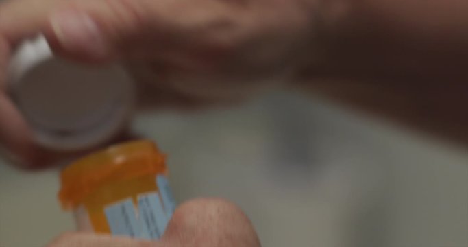 Senior woman with prescription drugs. Medication pill bottle