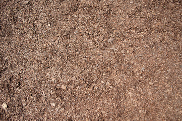 Background of seamless tiling wood chips used for safety in toddlers playgrounds.