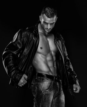 Handsome Athletic Male Model Wearing Leather Jacket on Naked Torso
