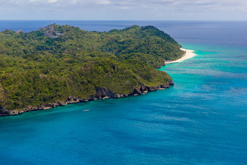 Aerial view from the drone on the landscape tropical sand beach with palm trees. Summer vacation consept.