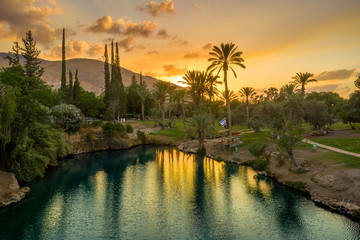 Aerial view of the sunset over Sachne or Gan Hashlosha oasis, with popular waterfall in Northern Israel