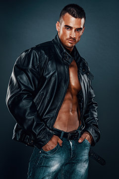 Handsome Athletic Male Model Wearing Leather Jacket on Naked Torso