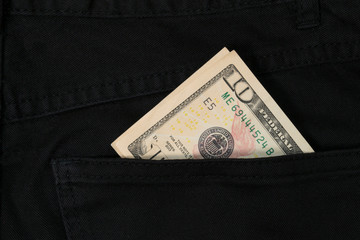 dollar banknote in jeans pocket