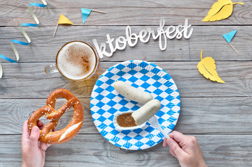 Oktoberfest, traditional festival food: white sausages, pretzel and beer