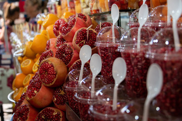 Juice Stand in market - pomegranate & orange