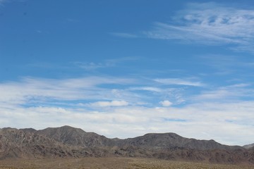 Fototapeta na wymiar Cloud patterns over the Bullion Mountains in Cleghorn Lakes Wilderness of the Southern Mojave Desert.
