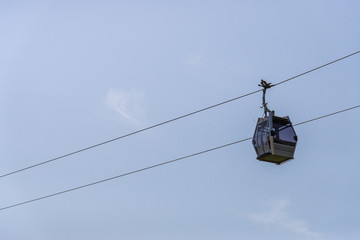 Cable cars transport against blue sky on a sunny day