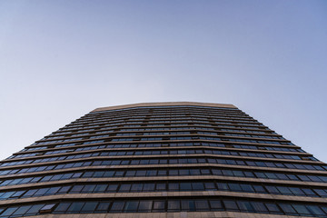 Fototapeta na wymiar A modern architecture skyscraper against blue sky
