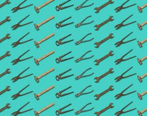 Seamless pattern of old retro random tools isolated on electric green background - flat layout