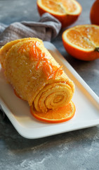 orange rolled cake portuguese. Brazo de naranja, Tarta portuguesa, flan, egg sweet cake, copy space