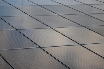 Solar panels at the top of the building. Solar modules on a flat roof.